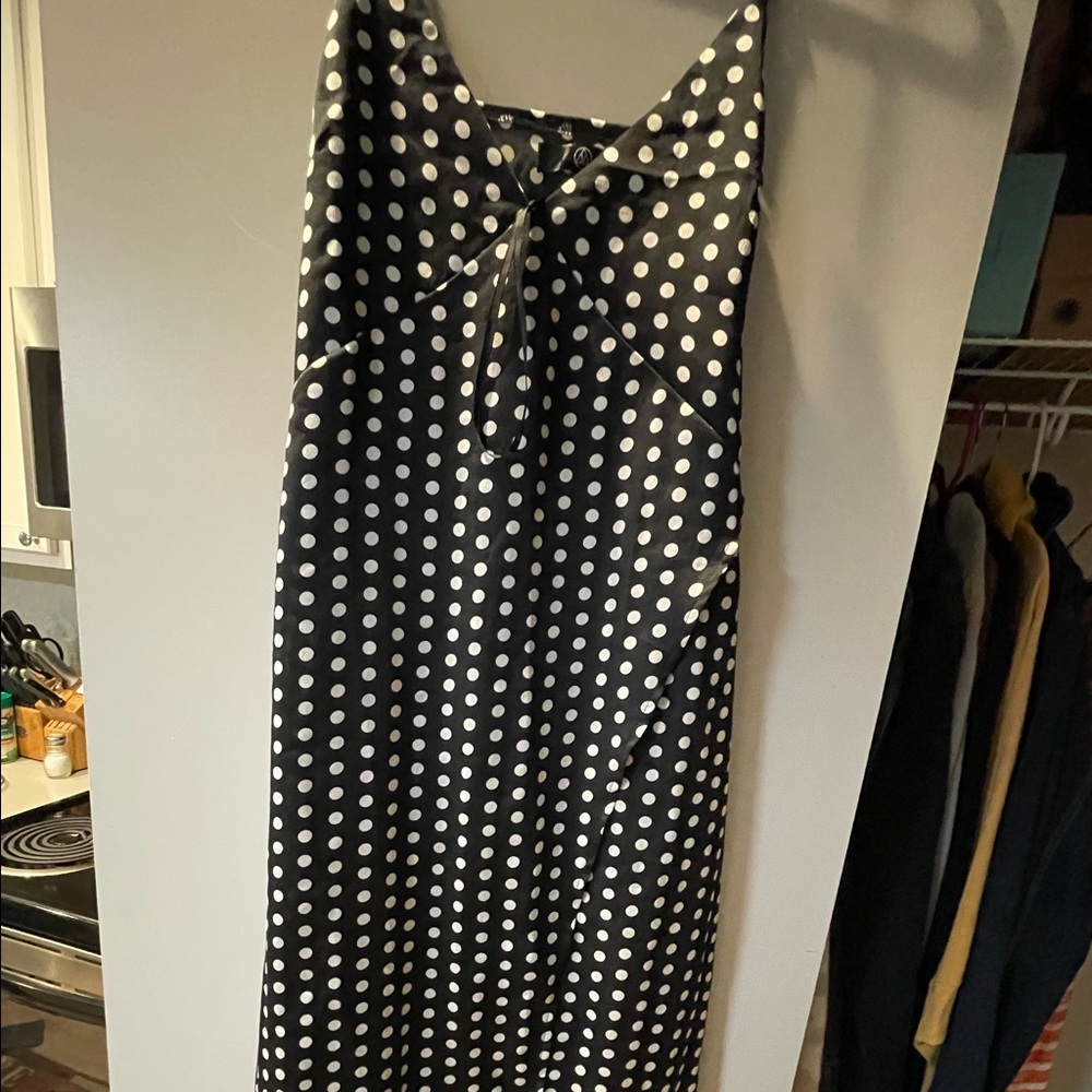 A black with white polkadots Sundress with split on the side size 10